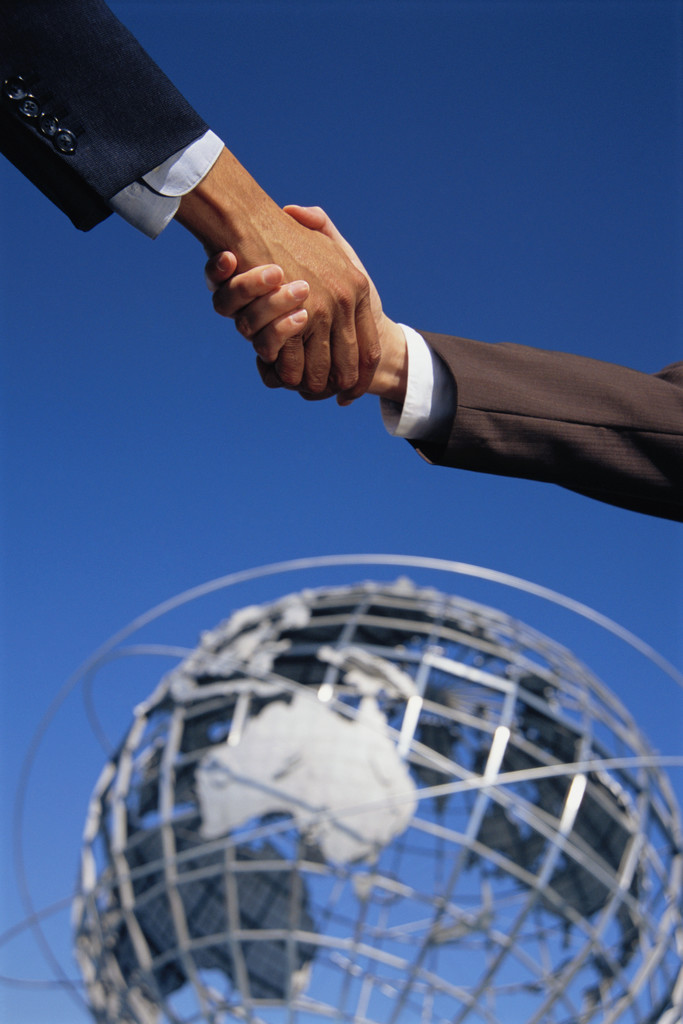 Business Handshake Before Globe